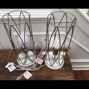 Pair of metal lamps with stone base.